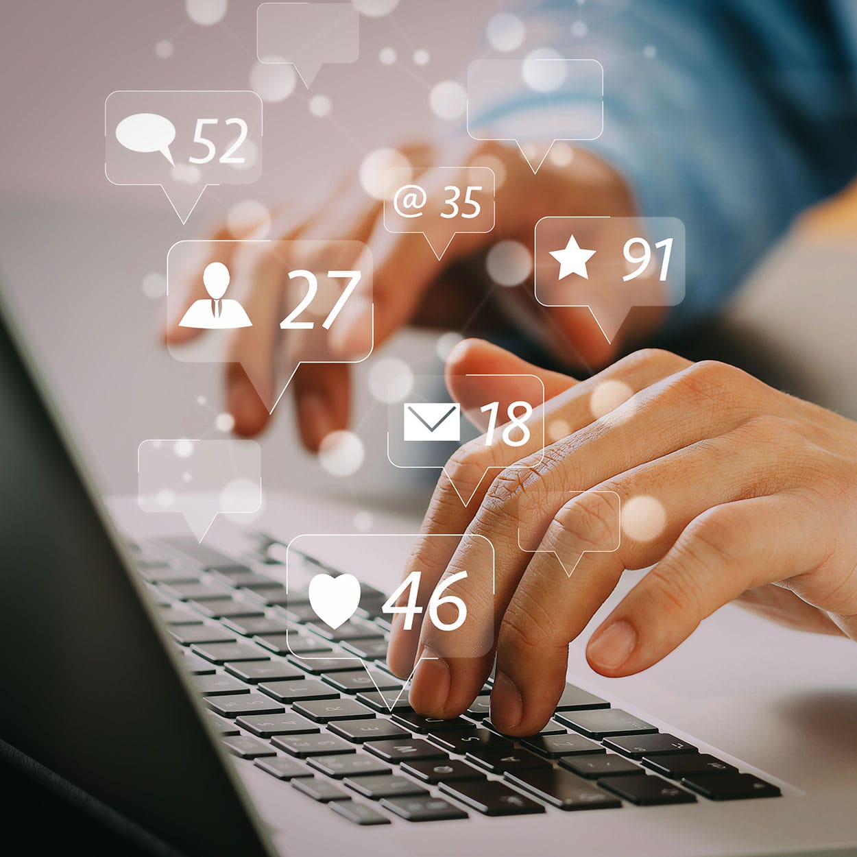 Close up of a man's hands using laptop on desk with creative social media community, likes, and shares icons as a hologram