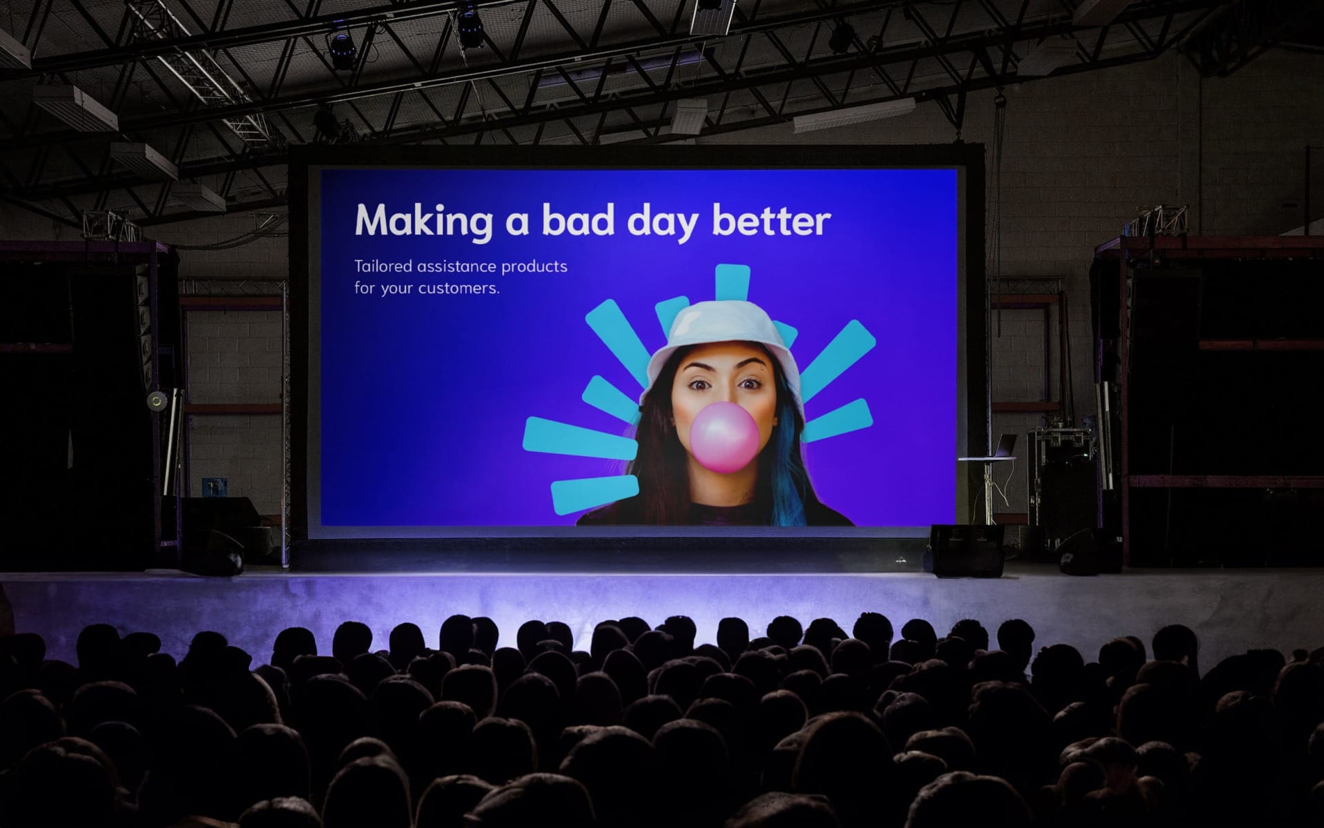 CPP re-brand displayed on large screen in front of an audience.