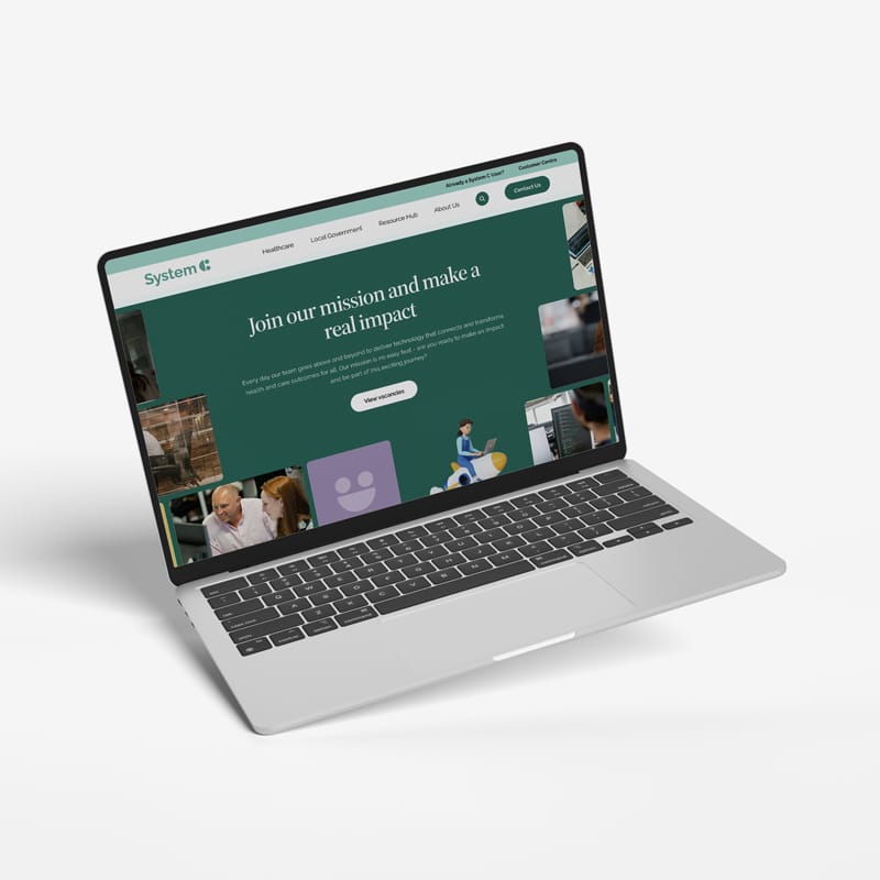 System C website page on laptop.