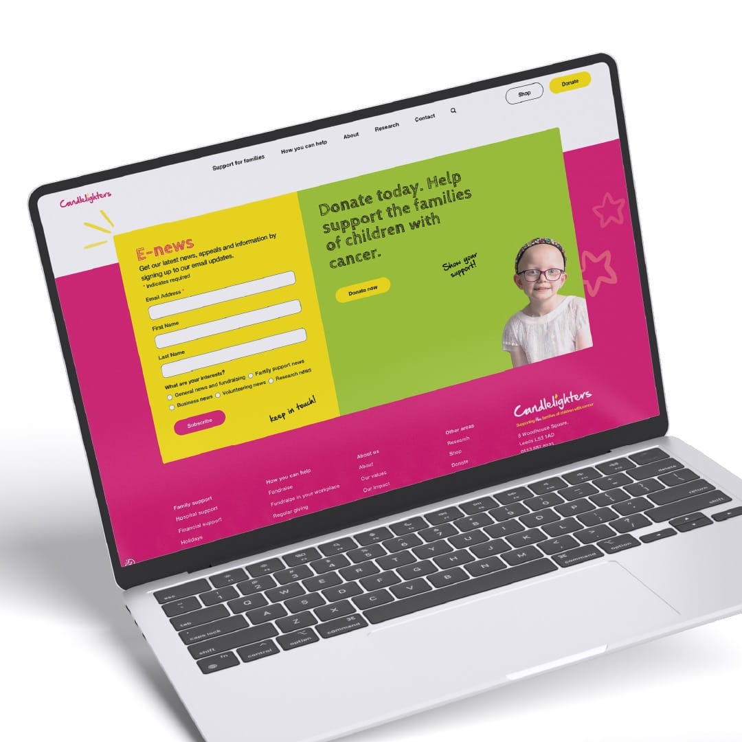 Laptop displaying the Candlelighters website with E-news signup and a donation appeal for families of children with cancer.